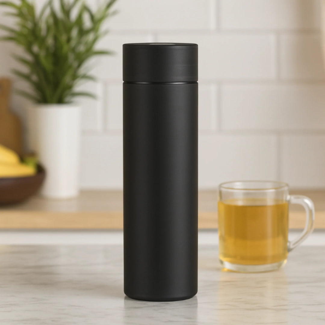 Techify™ thermos bottle placed on a modern table, showcasing smart insulation and durability — perfect for keeping drinks hot or cold during work, travel, or outdoor activities.